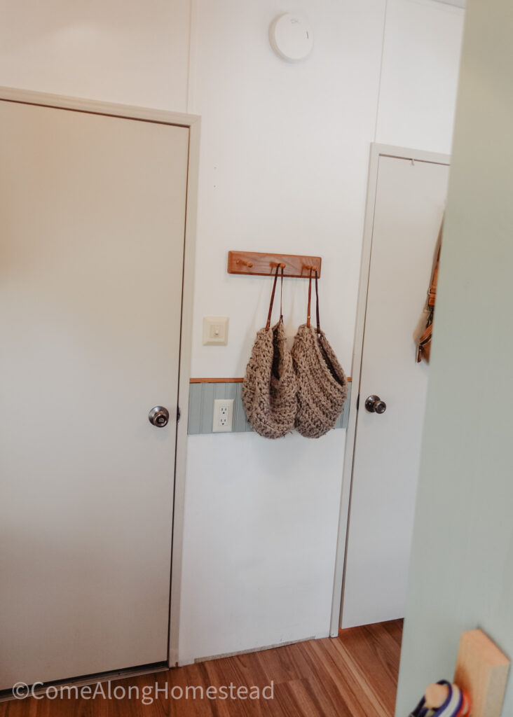 hanging area on the wall between two doors