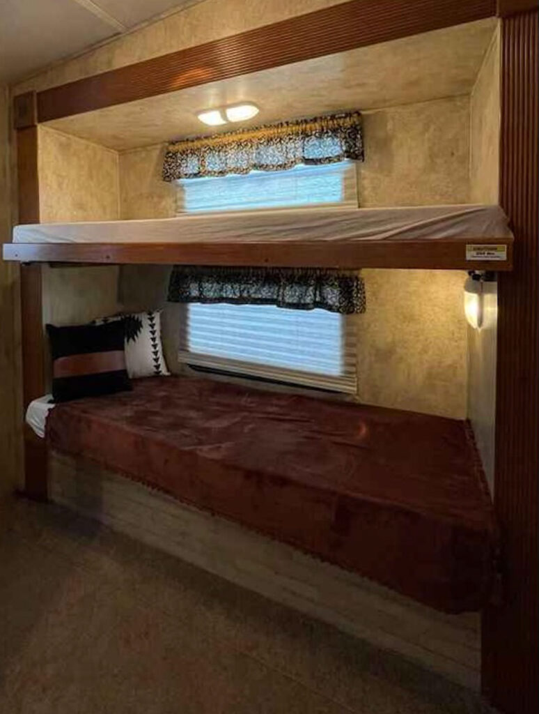 bunkbeds inside a rv with no side rails or ladder